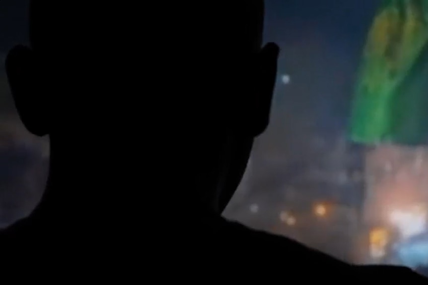 A silhouette of a man's head.