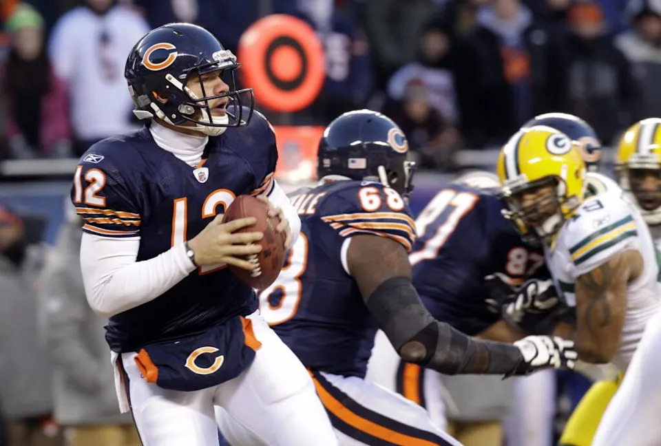 Jan 23, 2011; Chicago, IL, USA; Chicago Bears quarterback Caleb Hanie (12) drops back to pass during the fourth quarter of the 2011 NFC championship game against the Green Bay Packers at Soldier Field. Mandatory Credit: Jeff Hanisch-USA TODAY Sports