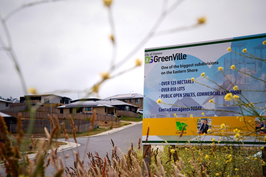 A real estate sign for GreenVille estate.