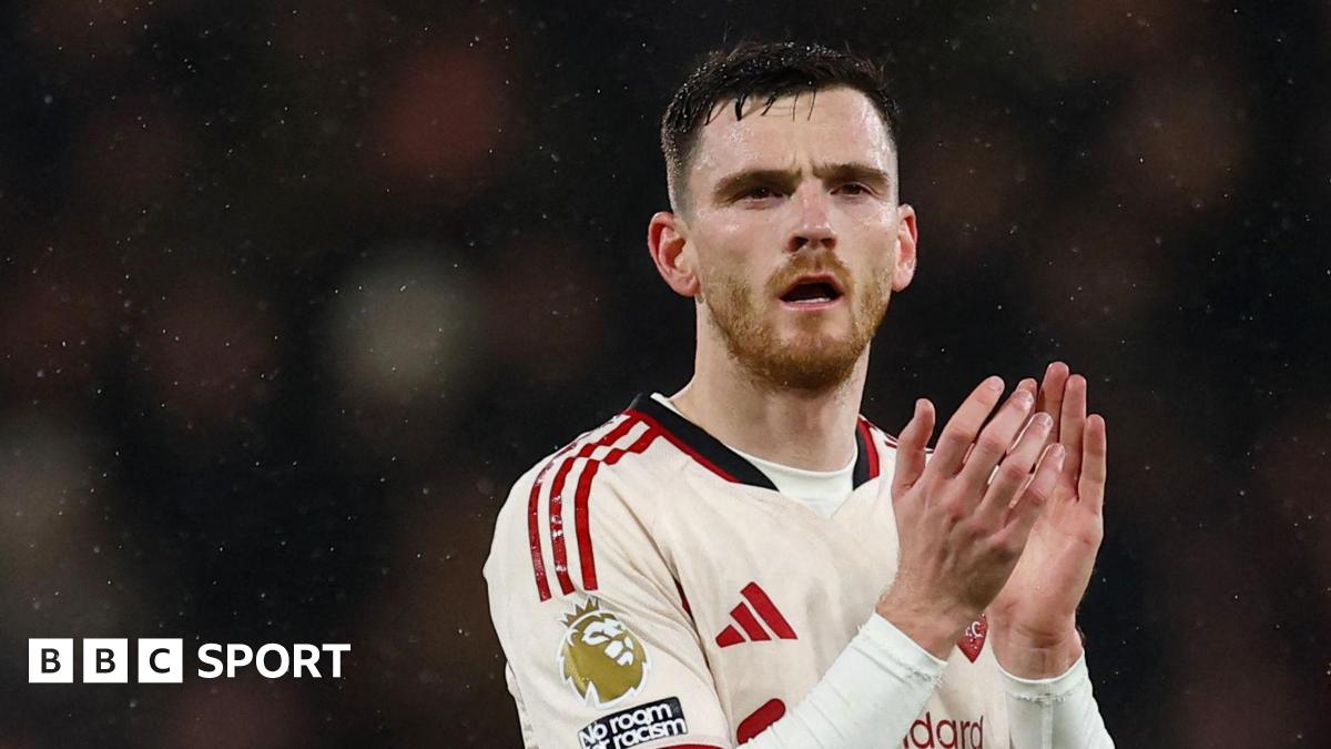 Liverpool left-back Andy Robertson applauds the fans