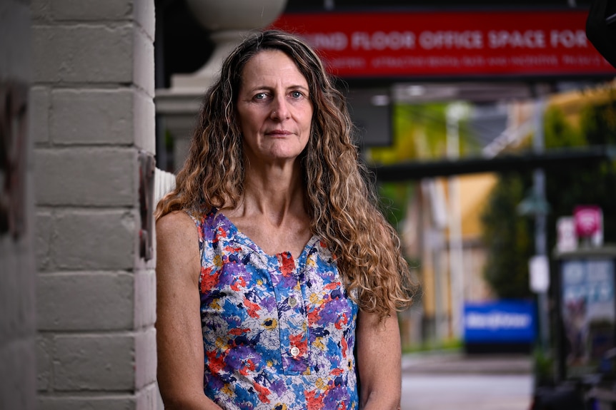 A woman next to a fence