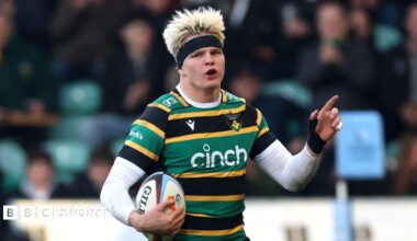 Henry Pollock celebrates on his way to scoring a try for Northampton