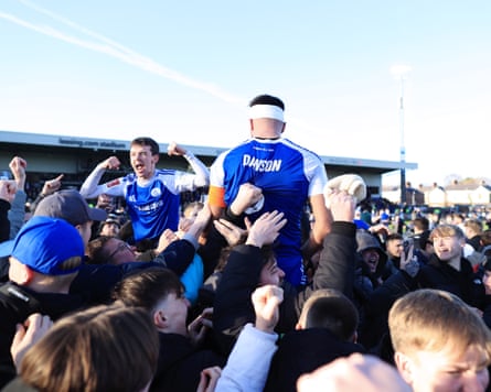 Macclesfield v Crystal Palace - Emirates FA Cup Third RoundMACCLESFIELD, ENGLAND - JANUARY 10: Fans hoist Luke Duffy of Macclesfield (L) and Paul Dawson of Macclesfield onto their shoulders as they celebrate victory after the Emirates FA Cup Third Round match between Macclesfield and Crystal Palace on January 10, 2026 in Macclesfield, England. (Photo by Simon Stacpoole/Offside/Offside via Getty Images)