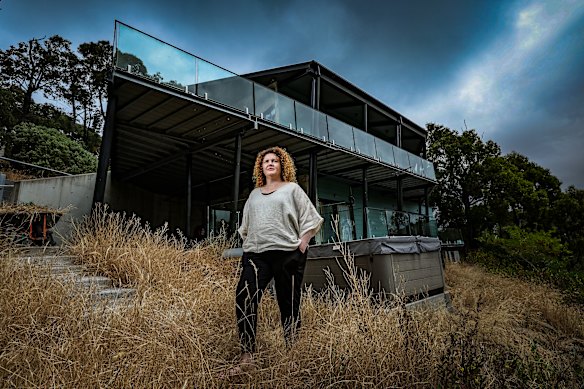Resilient Building Council CEO Kate Cotter in front of a house built to bushfire standards.