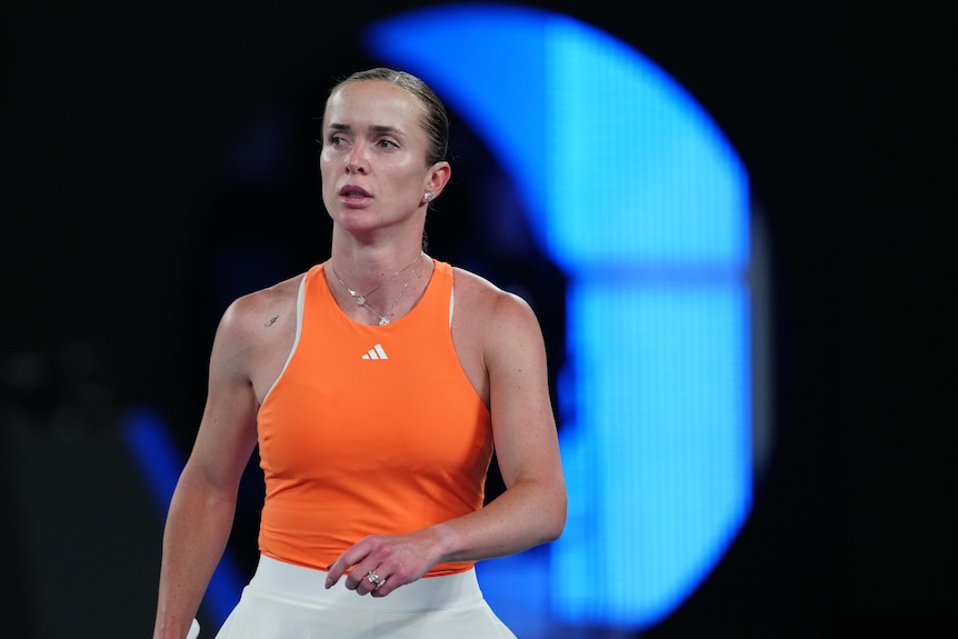 elina svitolina looks across the tennis court menacingly