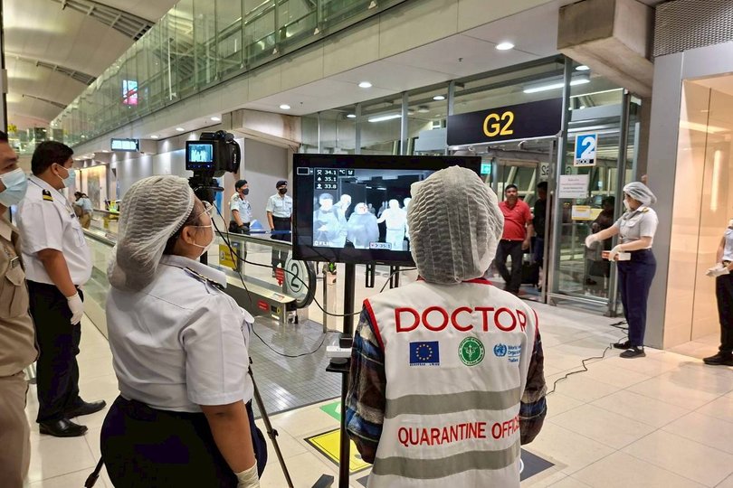 In this photograph provided by the public relations department of the Suvarnabhumi International Airport, Quarantine doctors watch thermal scanning of travelers from west Bengal, India at the Suvarnabhumi International Airport in Samut Prakarn, Thailand, on Sunday, Jan. 25, 2026. (Public relations department of Suvarnabhumi International Airport via AP)