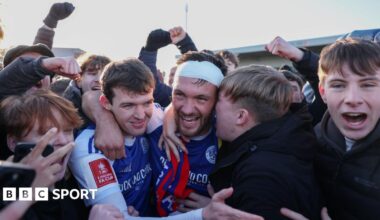 Paul Dawson of Macclesfield celebrates with team-mate Luke Duffy and fans after the team's victory over Crystal Palace