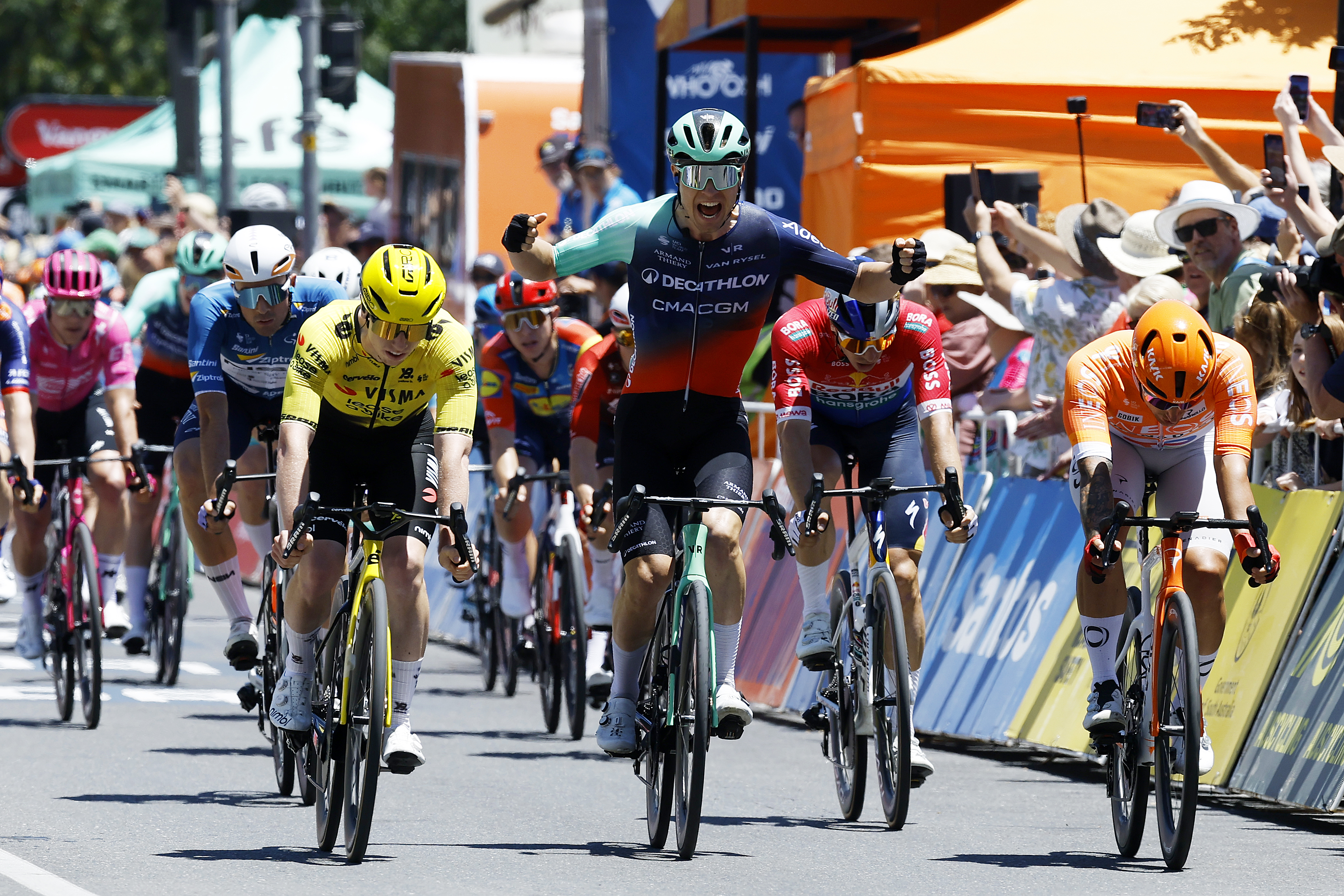 TANUNDA, AUSTRALIA - JANUARY 21: Tobias Lund Andresen of Denmark and Decathlon CMA CGM Team celebrates at finish line as stage winner (C) ahead of Matthew Brennan of Great Britain and Team Visma | Lease a Bike (L) and Sam Welsford of Australia and Team INEOS Grenadiers (R) during the 26th Santos Tour Down Under 2026, Stage 1 a 120.6km stage from Tanunda to Tanunda on January 21, 2026 in Tanunda, Australia. (Photo by Con Chronis/Getty Images)