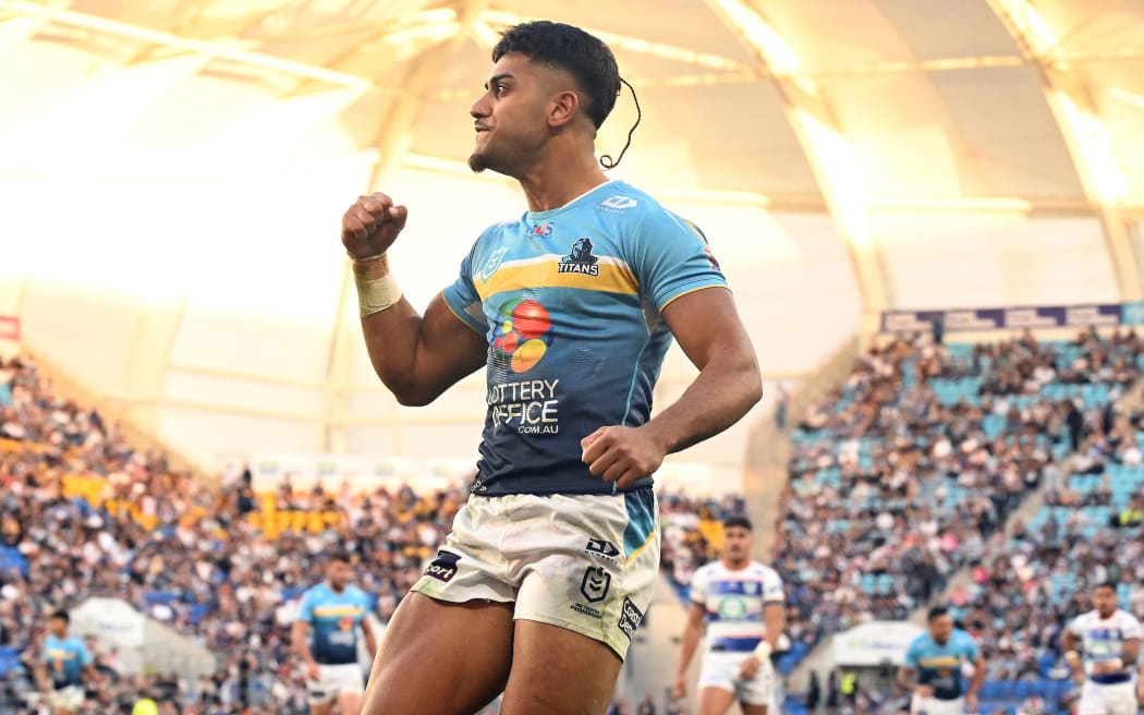 Alofiana Khan-Pereira of the Titans reacts after scoring a try during the NRL Round 16 match between the Gold Coast Titans and the New Zealand Warriors at Cbus Super Stadium.
