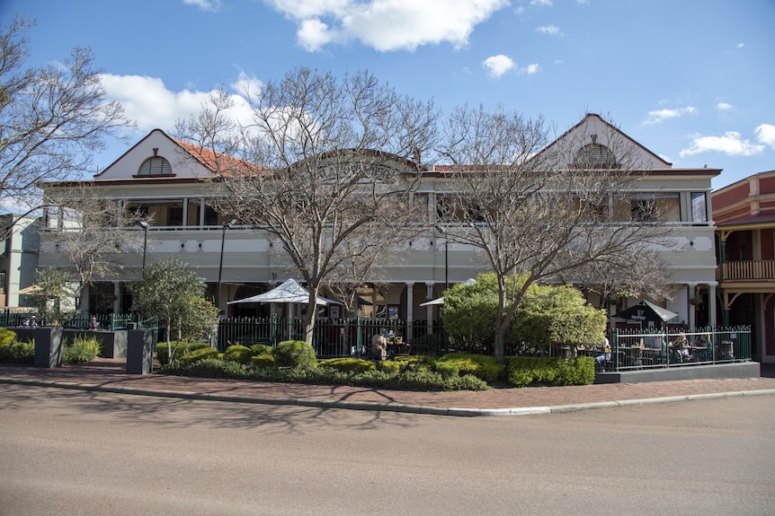 An older pub building in a suburban street