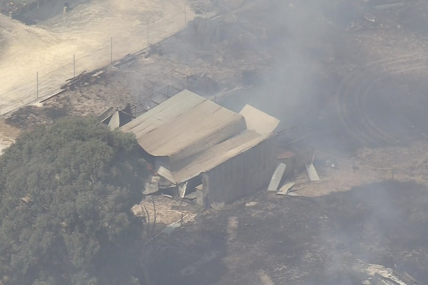 A shed that appears to be damaged 