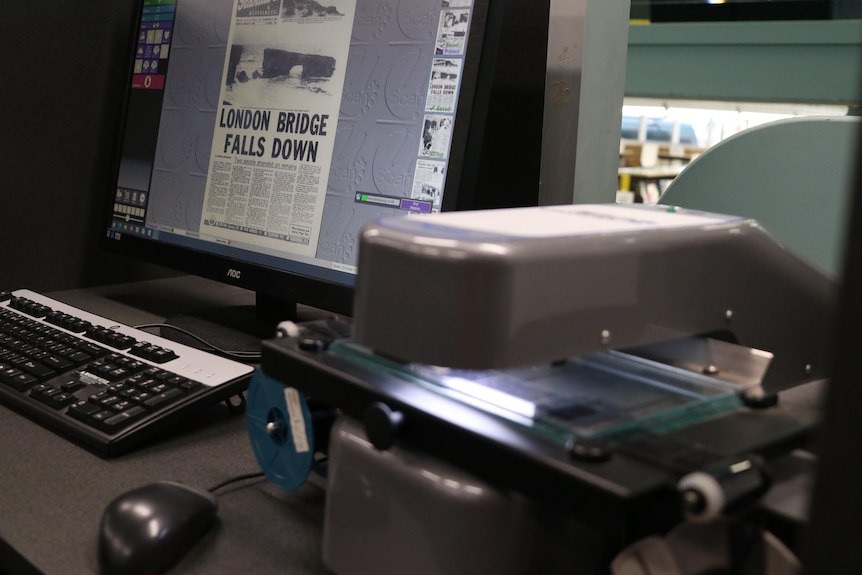 microfische and computer with newspaper on screen
