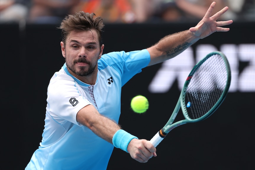 Stan Wawrinka plays a backhand at the Australian Open.