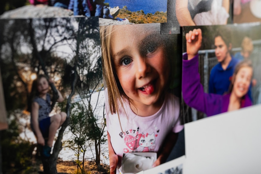 A photo of a young girl on the wall.
