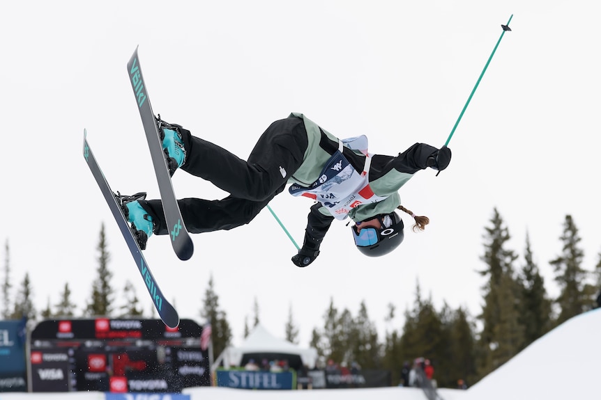Indra Brown skis up the side of a halfpipe