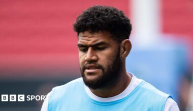 Luke Littler celebrates winning the 2026 PDC World Championship as tickertape falls