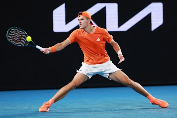 Jakub Mensik of Czechia plays a forehand against Ethan Quinn of United States.