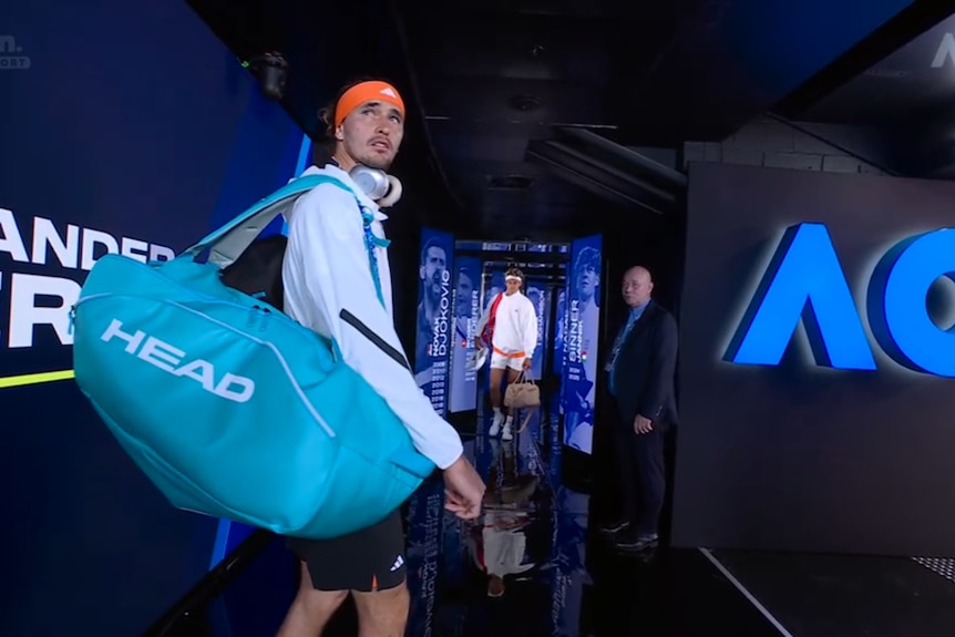 Alexander Zverev looks over his shoulder in the players' tunnel before going on court at the Australian Open.