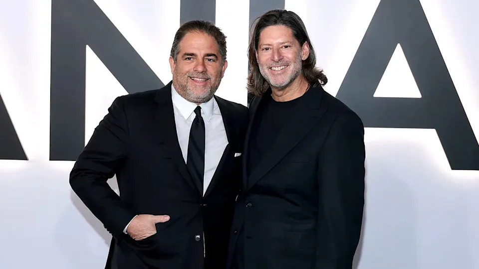 Brett Ratner and Marc Beckman pose together while attending a premiere event.