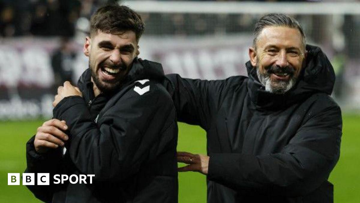 Claudio Braga and Derek McInnes celebrate Hearts' win
