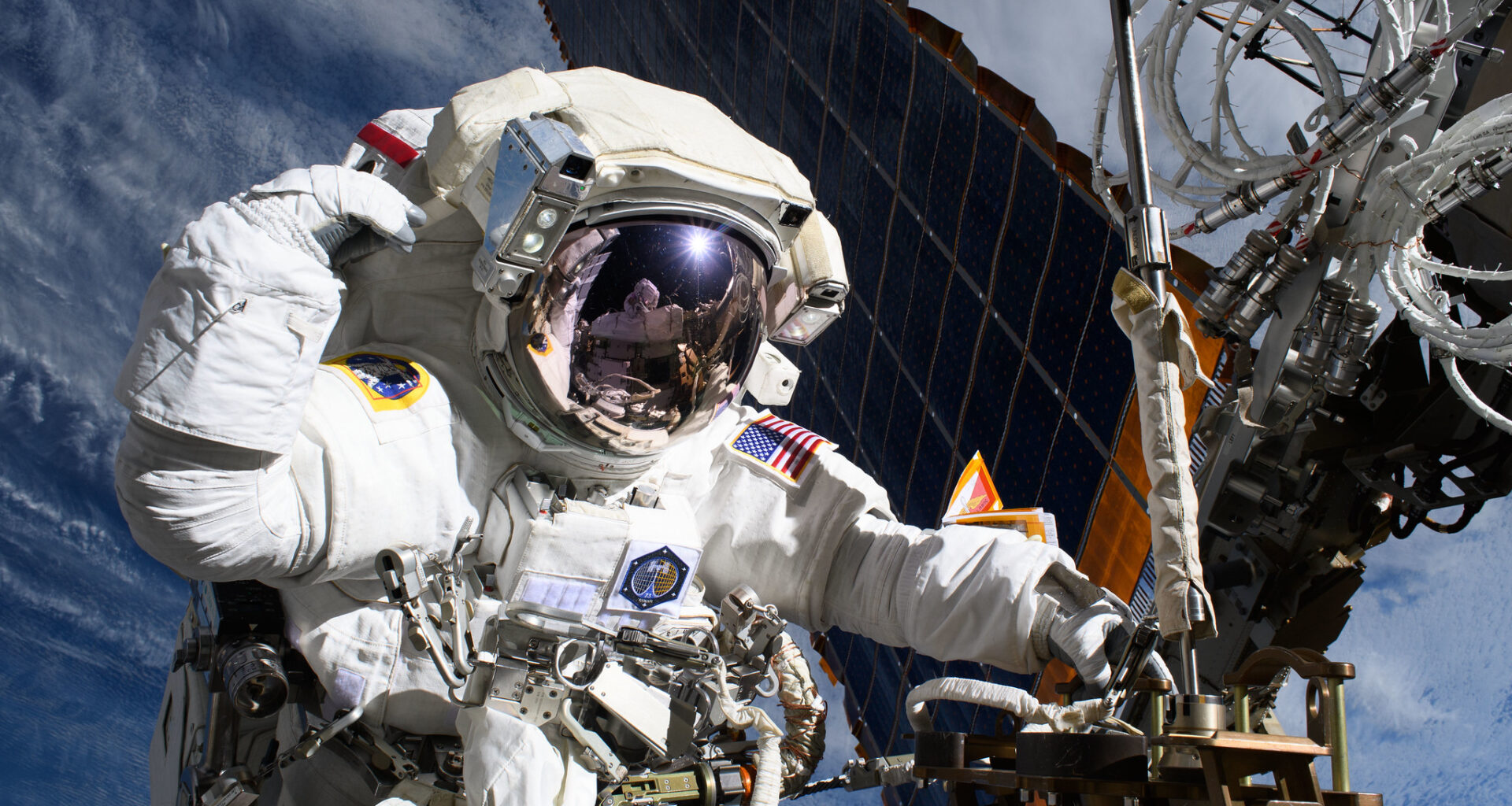 Astronaut Anne McClain is pictured near one of the International Space Station's main solar arrays