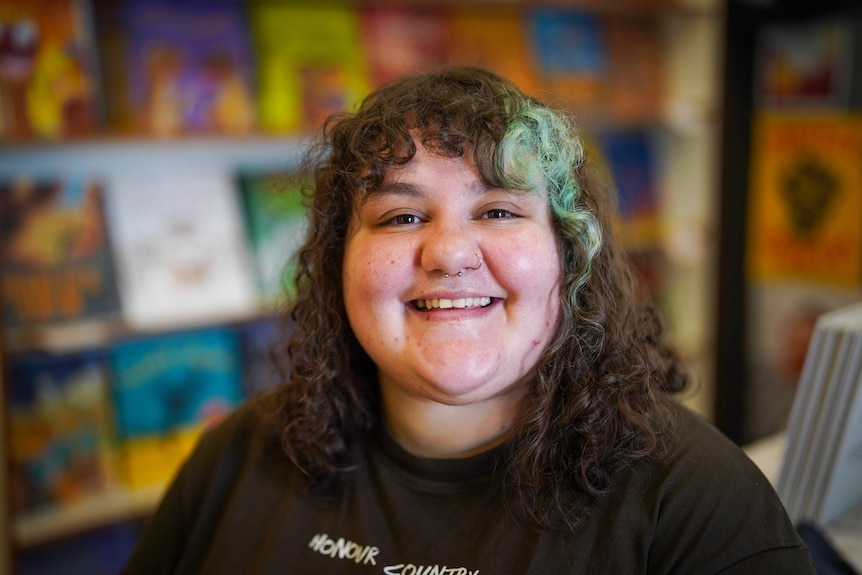 A portrait photo of Skye Cusak look at the camera smiling.