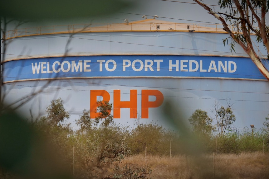 A water tank with the words "Welcome to Port Hedland" and the BHP logo.