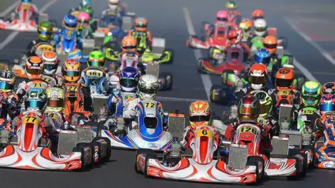 Maisy Creed Racing Karts racing on a track