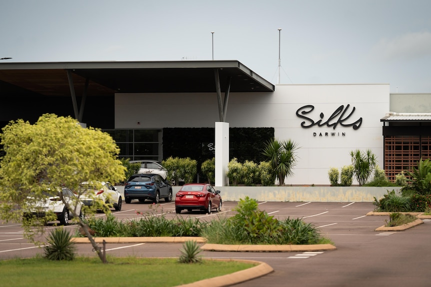 The exterior of a building with the words Silks Darwin on the front