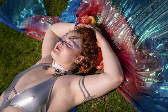 India Wade, a senior at Northwestern, rests in between headliners during an end of the school year festival.
