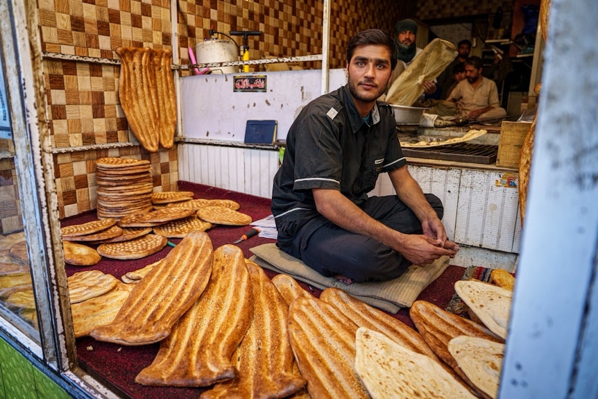 An Afghan vendor lines out naan in a room for customers in Kabul.