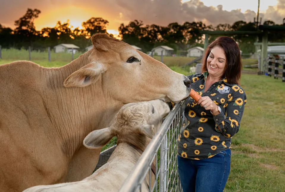 Splitters Farm's Carly Clark feeds farm animals. 