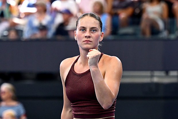 Marta Kostyuk celebrates after winning the first set.
