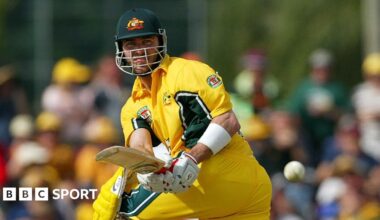 Damien Martyn stood on a beach at dawn, looking out to sea