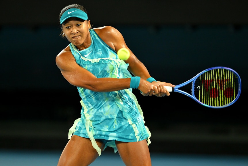 Naomi Osaka plays a backhand at the Australian Open.