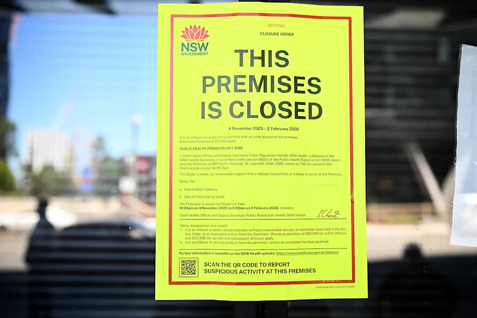 A sign on a tobacconist's window informs customers that the shop has been closed for three months.