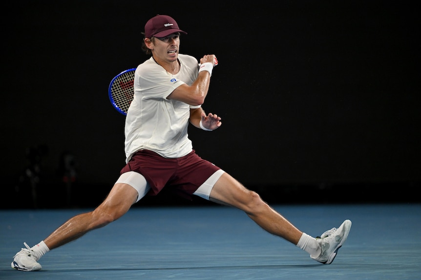 Alex de Minaur plays a groundstroke at the Australian Open.