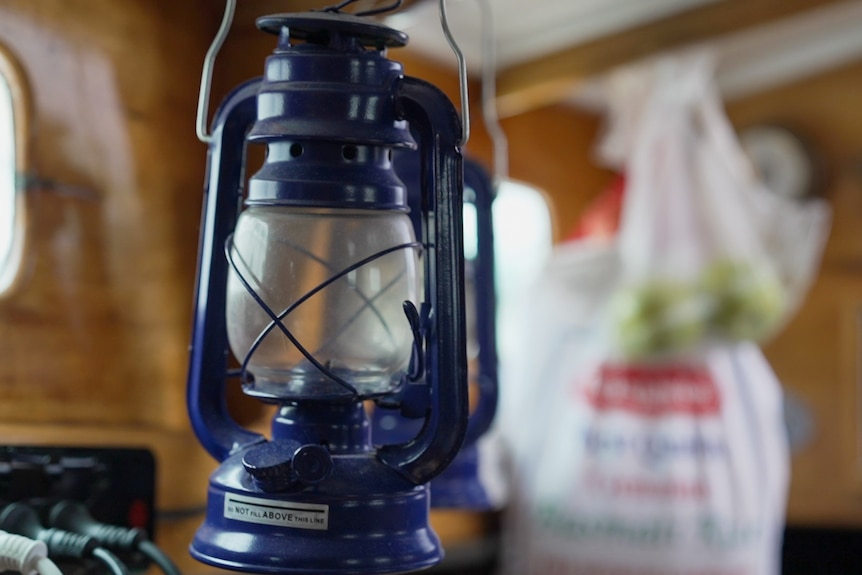 A blue landern inside a boat.