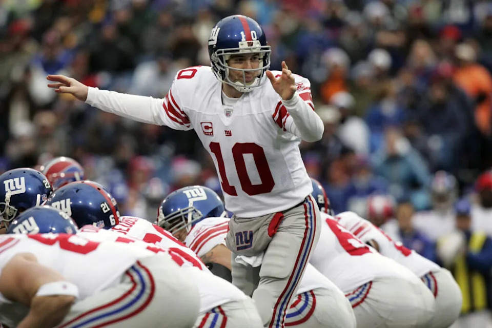 December 23, 2007; Orchard Park, NY, USA; New York Giants quarterback (10) Eli Manning calls an audible at the line of scrimmage during a game against the Buffalo Bills at Ralph Wilson Stadium. Mandatory Credit: John Sokolowski-USA TODAY Sports