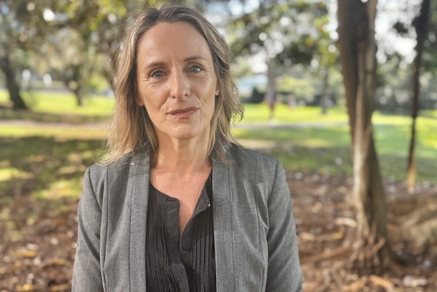 Sue Higginson Greens environment spokesperson stands outdoor as she speaks to media about asbestos contaminated mulch