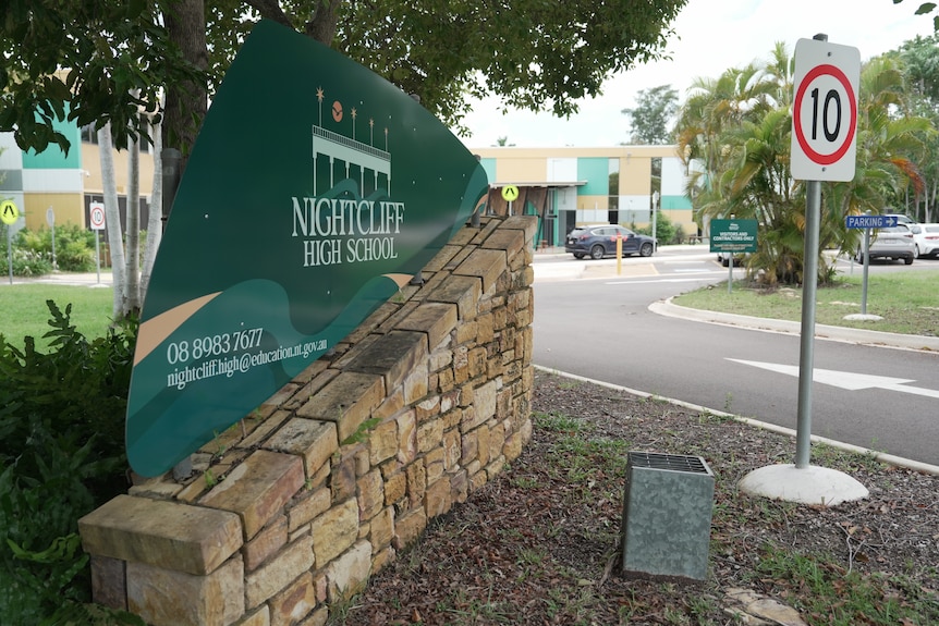 An image of a sign reading Nightcliff High School at the entrance to school.