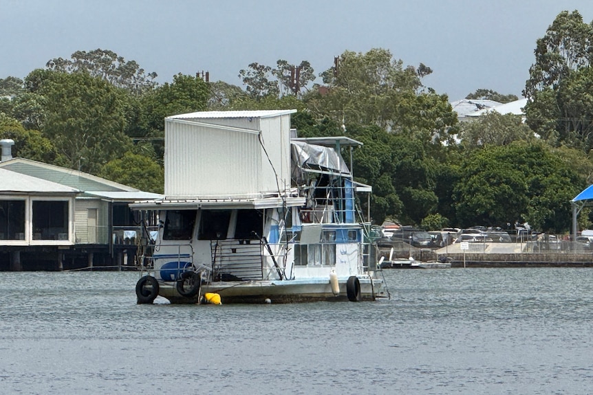 Houseboat on river.
