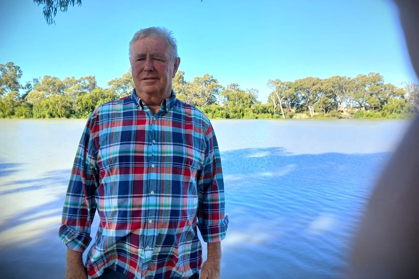 A man stares at the camera