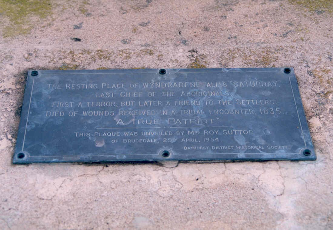 A metal plaque that reads The resting place of Windradyne alias "Saturday"