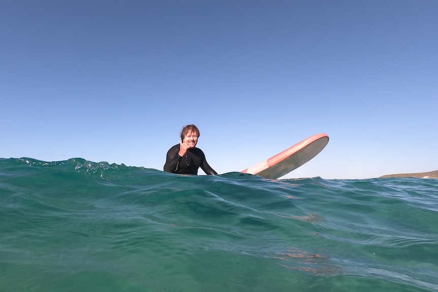 Sascha on a surf board. 