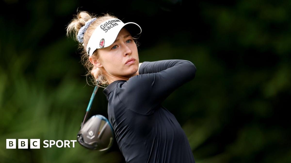 Nelly Korda looks down the course at the end of the follow-through from a shot