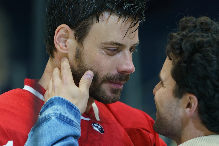 Screenshot from TV show Heated Rivalry, showing character Scott Hunter preparing to kiss his boyfriend.