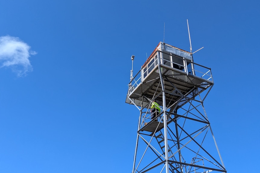 An elevated structure with stairs leading up to a small cabin.