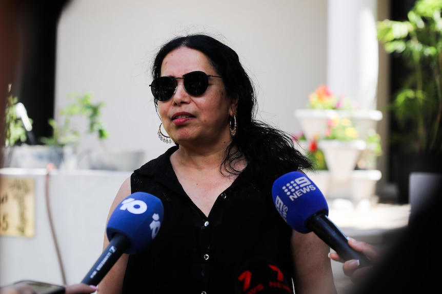 Sandhya Sringar talks in front of media microphones