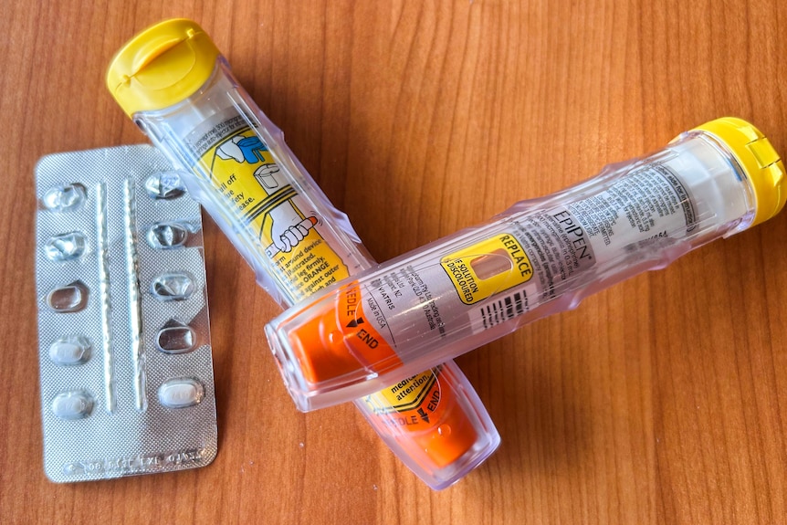 Two epipens and medication on the table.